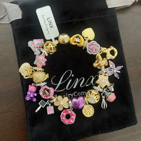 Linx Yellow Gold Snake Chain Bracelet with Gold Purple and Pink Themed Charms